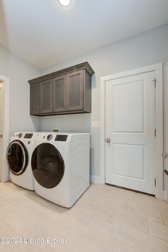 laundry room featuring cabinets and independent washer and dryer