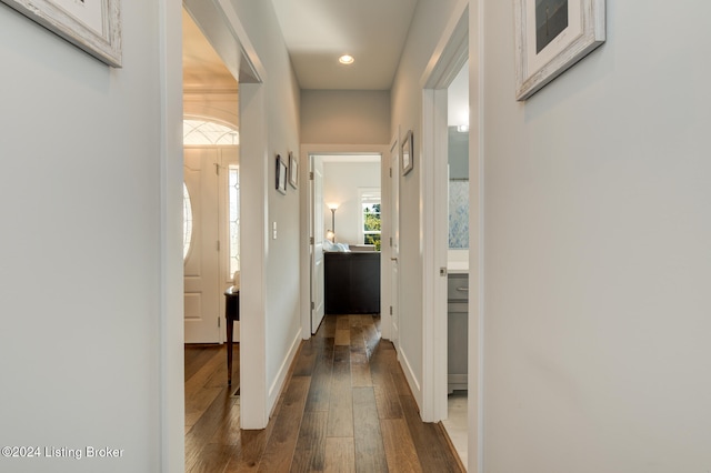 hall with dark hardwood / wood-style flooring