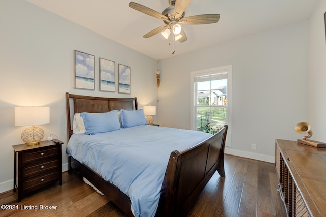 bedroom with ceiling fan and dark hardwood / wood-style flooring