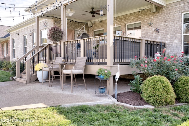 exterior space with ceiling fan