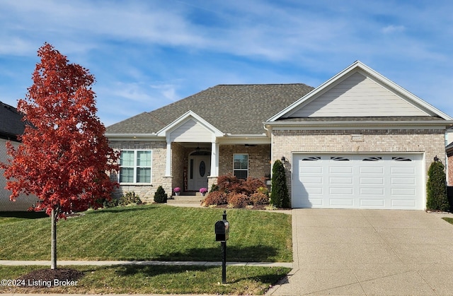 view of front facade featuring a garage and a front lawn