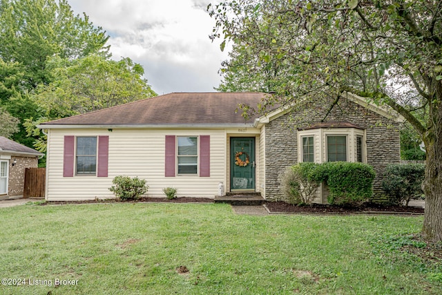 single story home featuring a front yard