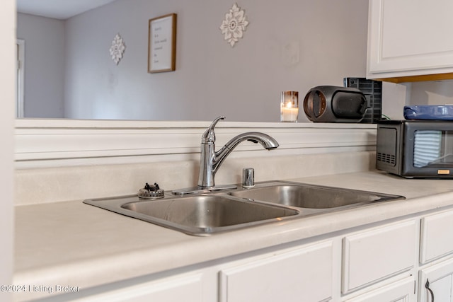 kitchen with sink and white cabinets