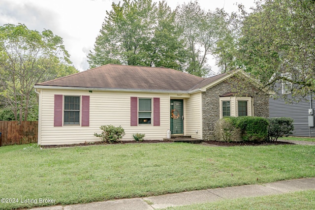 single story home with a front lawn