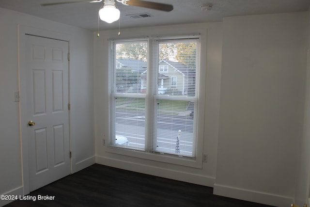 entryway featuring ceiling fan and dark wood-type flooring