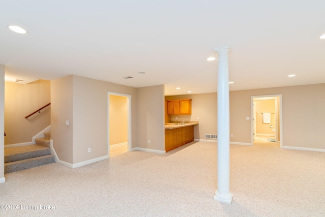 unfurnished living room with light colored carpet