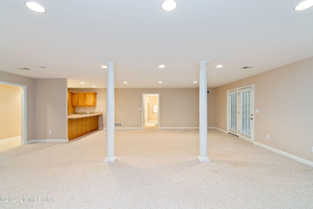 basement featuring light colored carpet