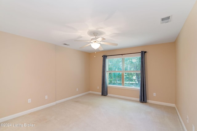 carpeted empty room with ceiling fan