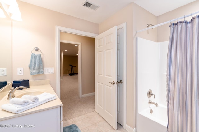 bathroom featuring shower / bath combo and vanity