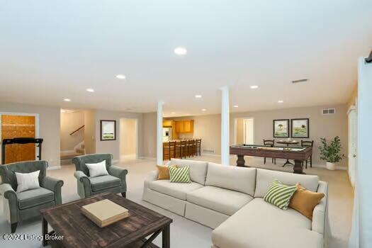 carpeted living room with billiards