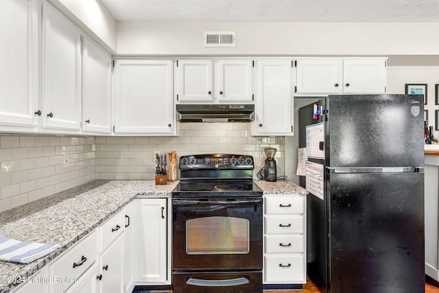 kitchen featuring light stone counters, white cabinets, decorative backsplash, and black appliances