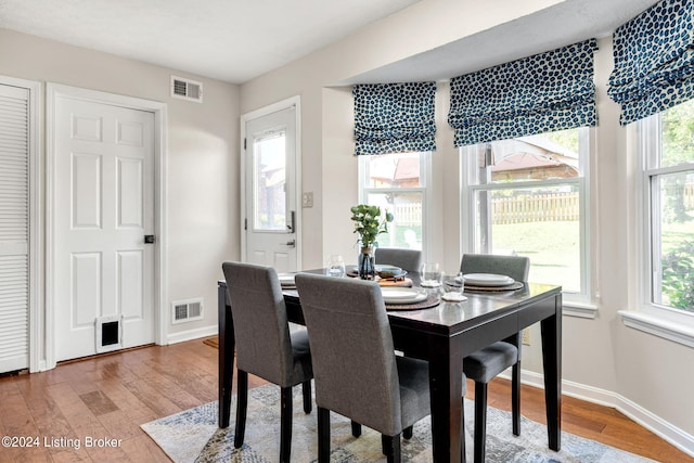 dining area featuring hardwood / wood-style flooring and plenty of natural light