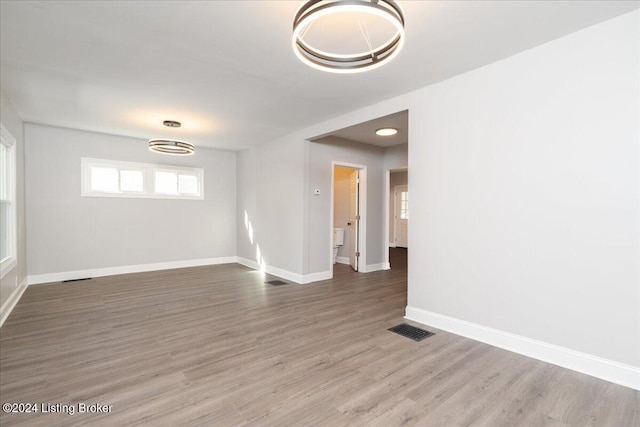 spare room with hardwood / wood-style flooring