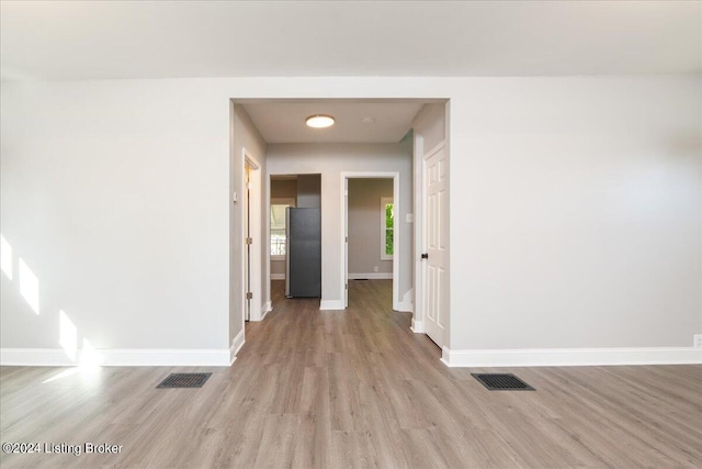 spare room with light hardwood / wood-style floors