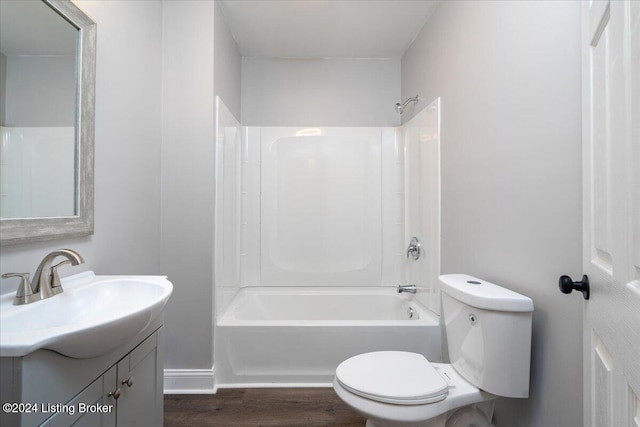 full bathroom featuring hardwood / wood-style floors, vanity, toilet, and shower / bathtub combination