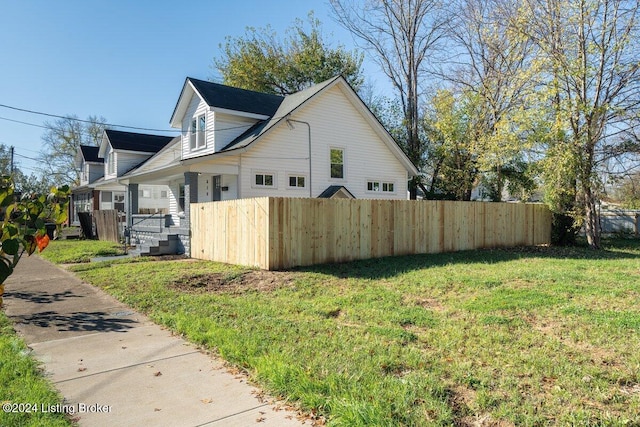 view of home's exterior with a lawn