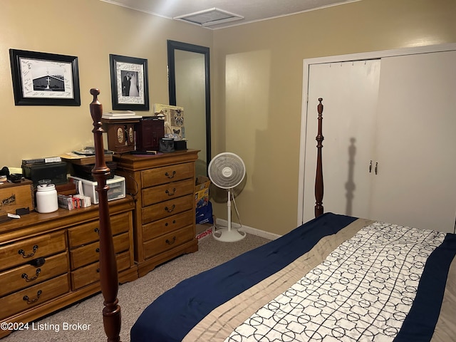 carpeted bedroom with a closet