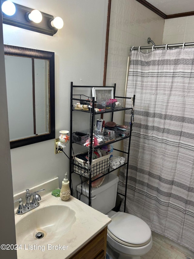 bathroom featuring vanity, tile patterned floors, toilet, ornamental molding, and curtained shower