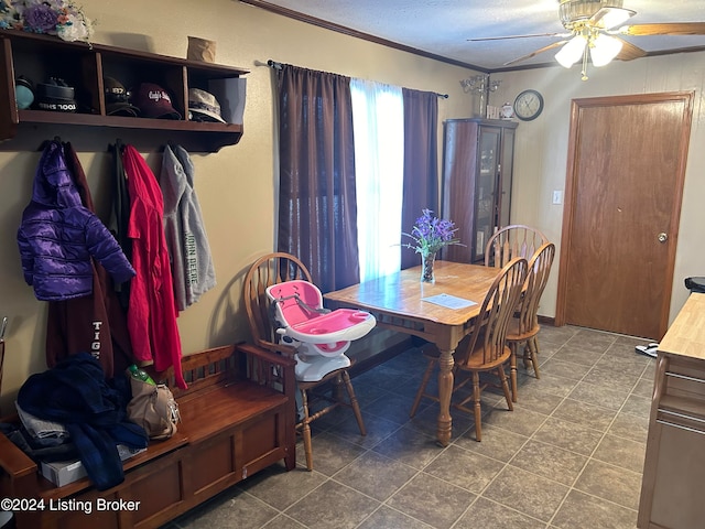 dining area with ceiling fan, tile patterned flooring, crown molding, and a textured ceiling