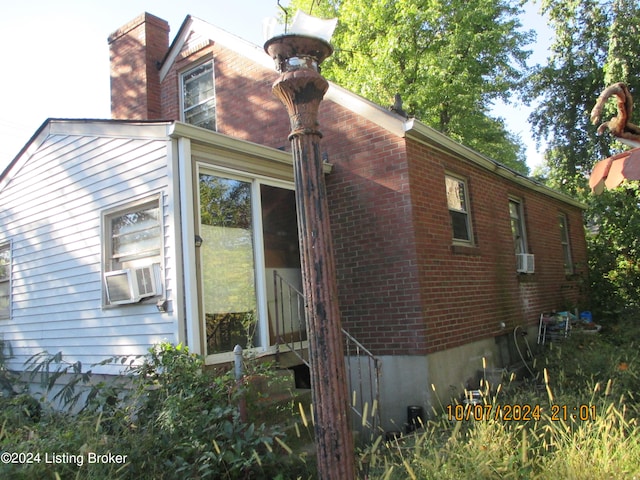 view of home's exterior with cooling unit