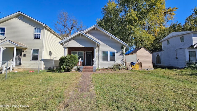 view of front of home with a front lawn