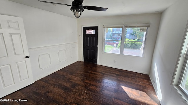 foyer with dark wood-type flooring, a healthy amount of sunlight, and ceiling fan