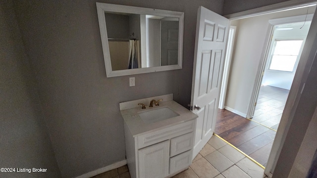 bathroom with vanity and hardwood / wood-style flooring