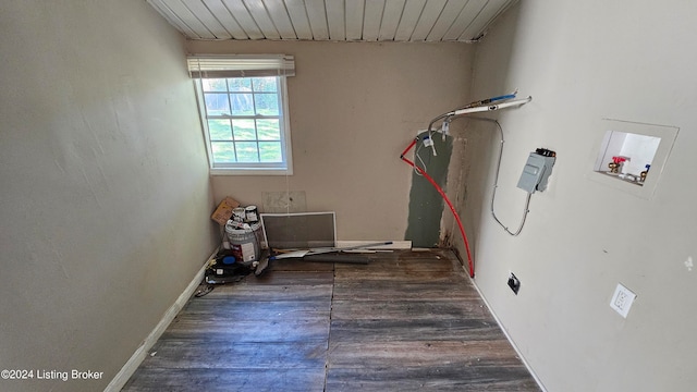 laundry room featuring hookup for a washing machine, electric dryer hookup, and dark wood-type flooring