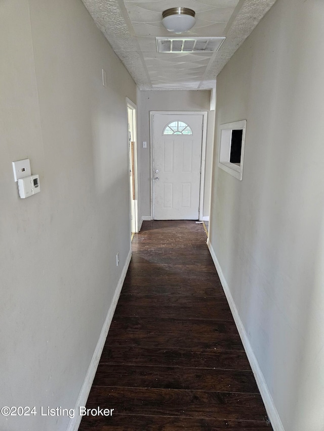 hall featuring dark wood-type flooring