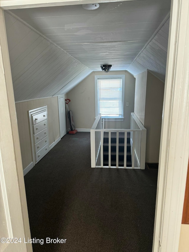 bonus room featuring carpet and lofted ceiling