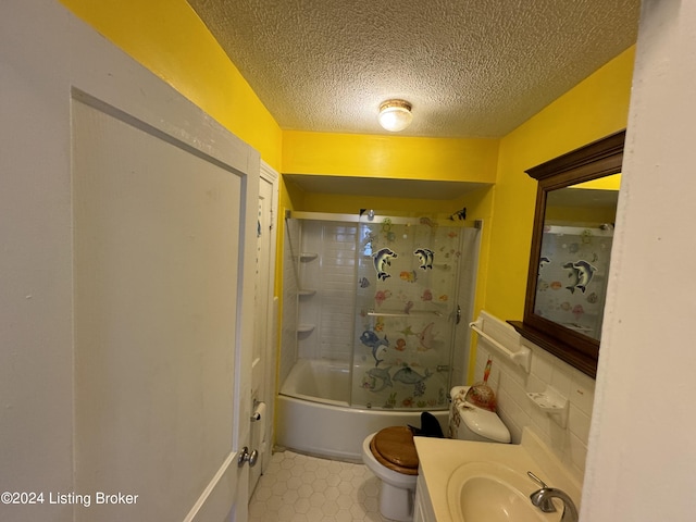 full bathroom featuring shower / bathing tub combination, vanity, toilet, and a textured ceiling