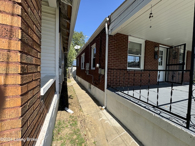 view of property exterior with covered porch