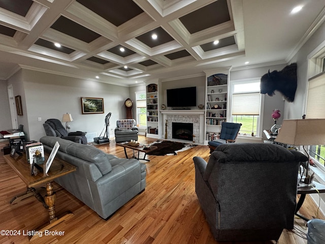 living room featuring coffered ceiling, crown molding, hardwood / wood-style flooring, and beam ceiling