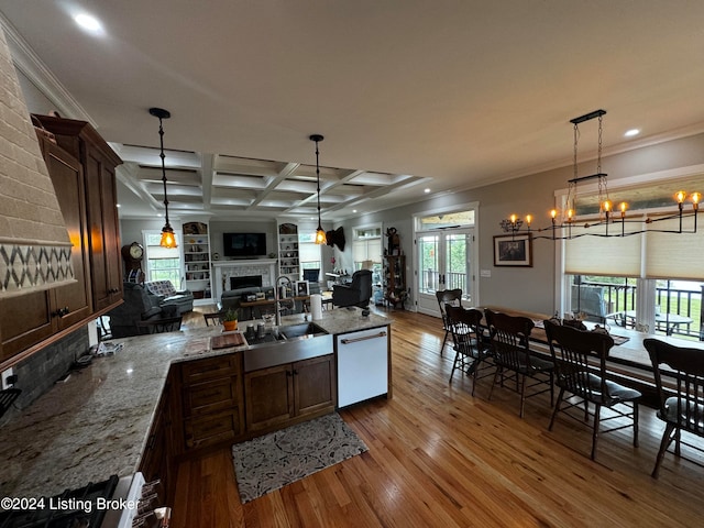 kitchen featuring coffered ceiling, white dishwasher, ornamental molding, sink, and light wood-type flooring