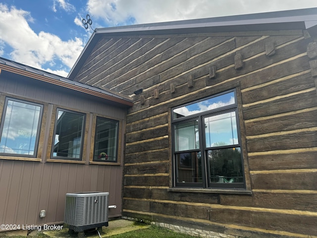 view of side of home featuring cooling unit