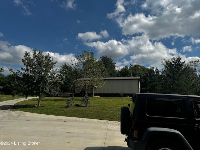 view of side of home featuring a lawn