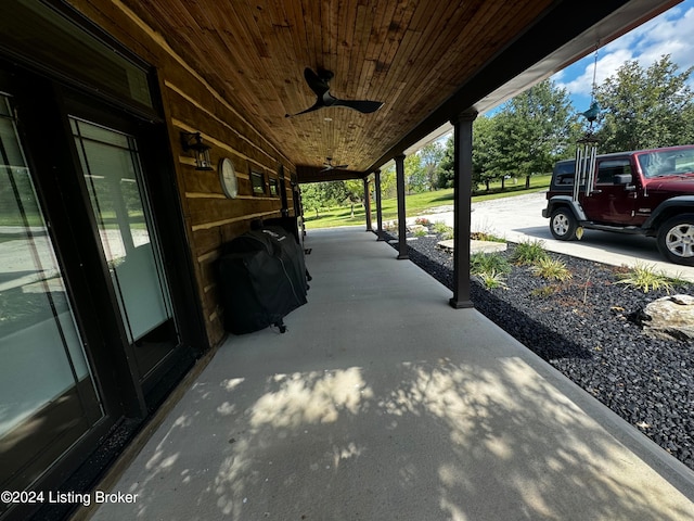 view of patio featuring area for grilling, covered porch, and ceiling fan