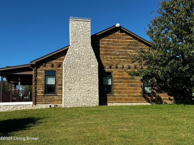 view of side of home featuring a yard