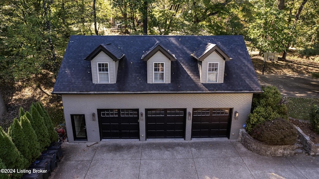 garage with concrete driveway