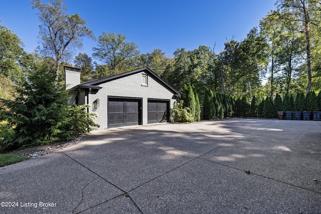 garage featuring driveway