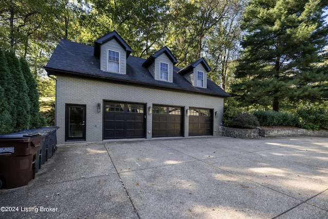 garage with concrete driveway