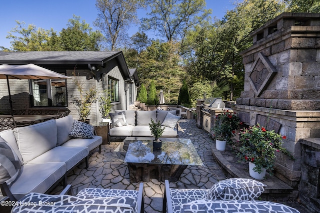 view of patio / terrace with an outdoor living space and area for grilling