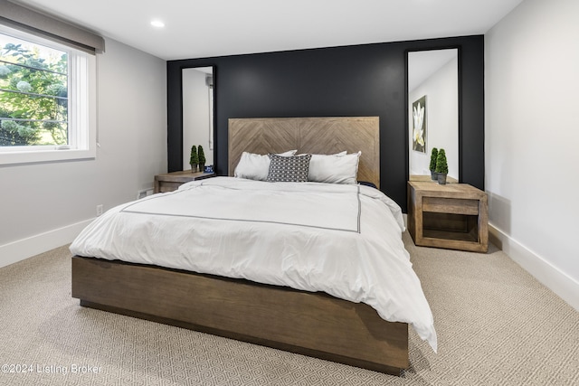 carpeted bedroom featuring recessed lighting and baseboards