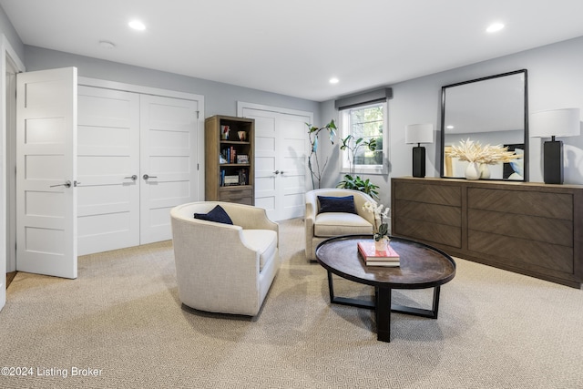 living area featuring carpet floors and recessed lighting