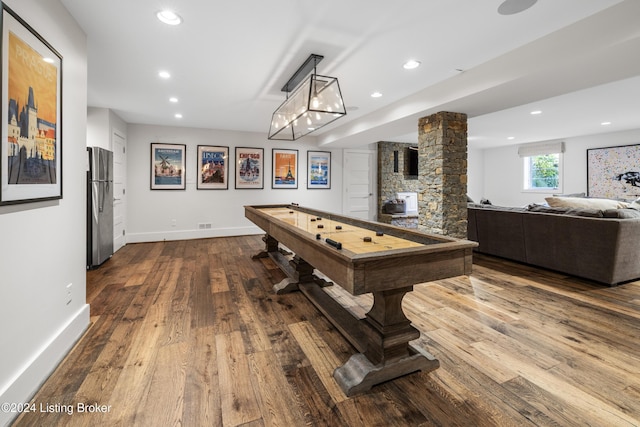 game room featuring recessed lighting, dark wood-style flooring, decorative columns, and baseboards