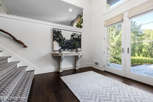 doorway to outside with baseboards, visible vents, stairway, wood finished floors, and french doors