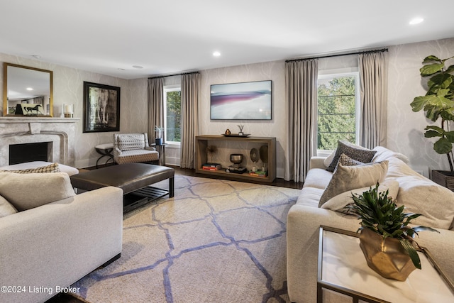 living room featuring recessed lighting and a premium fireplace