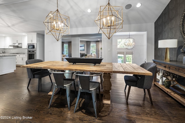 dining space featuring a chandelier, dark wood-type flooring, and recessed lighting