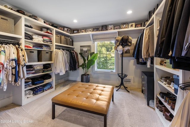 walk in closet with visible vents and carpet flooring