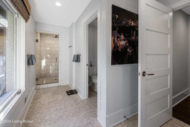 bathroom featuring recessed lighting, visible vents, toilet, a stall shower, and baseboards